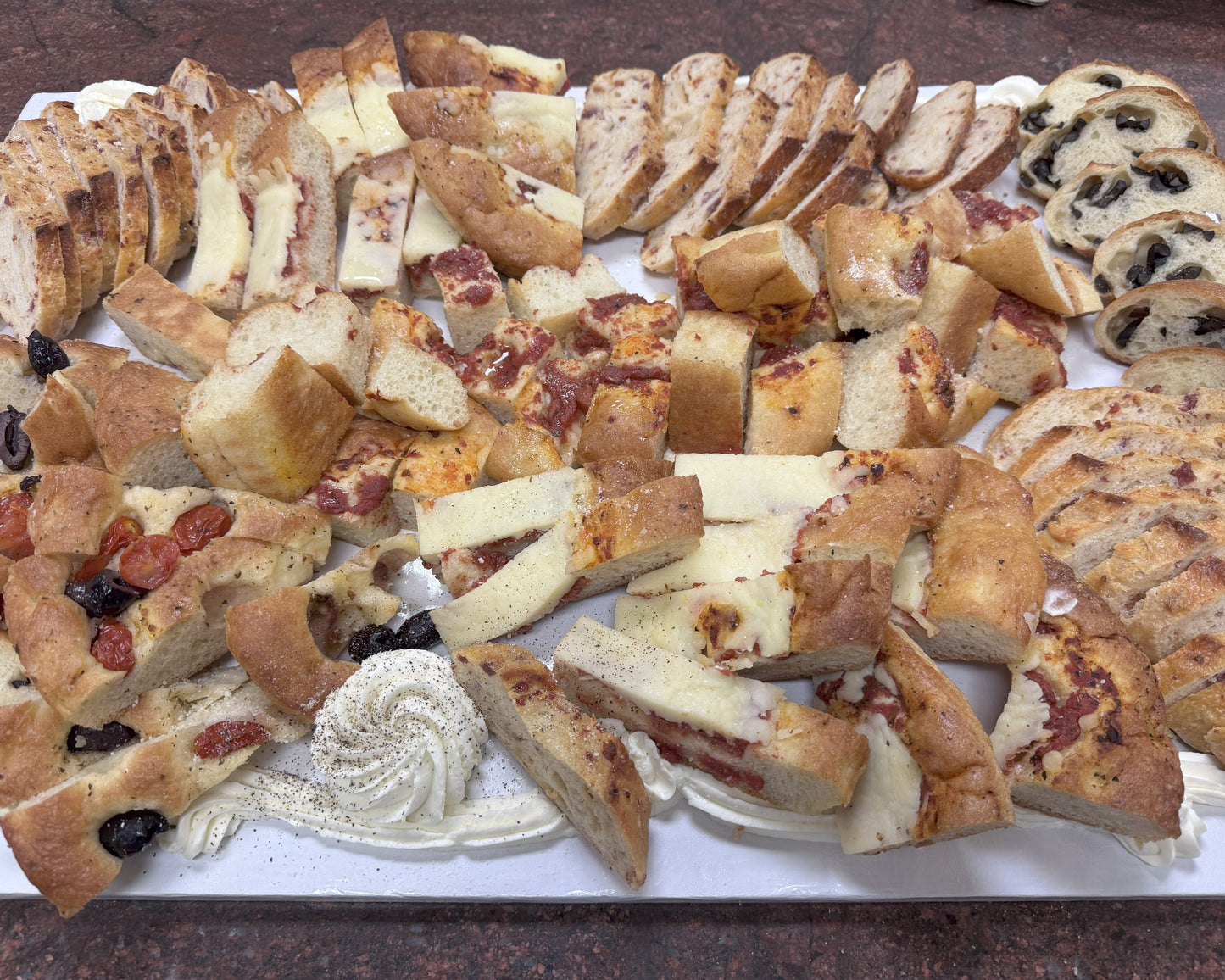 Assorted sliced bread board with mascarpone