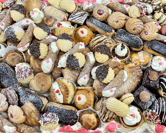 Assorted assortment of cookies with various toppings and glazes.