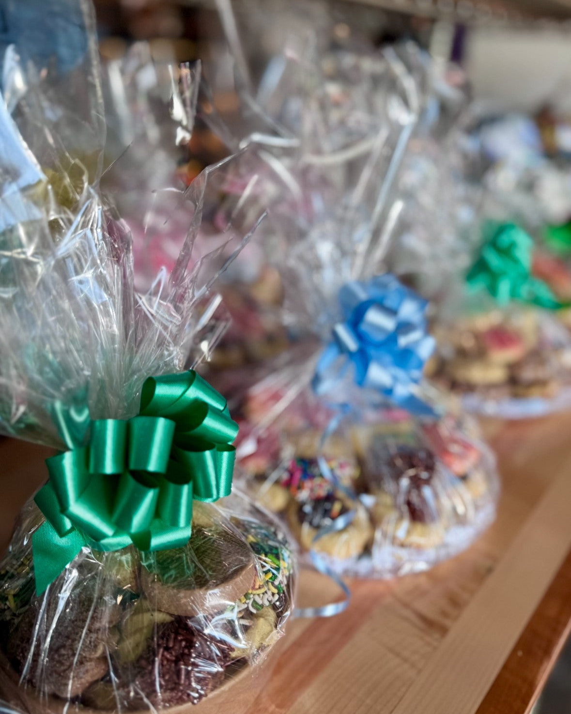 Wrapped cookie platters with decorative ribbon