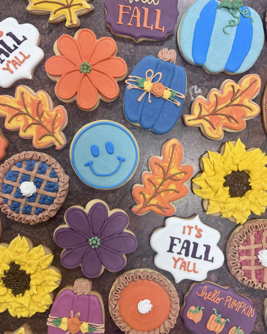 Collection of fall-themed cookies with colorful icing